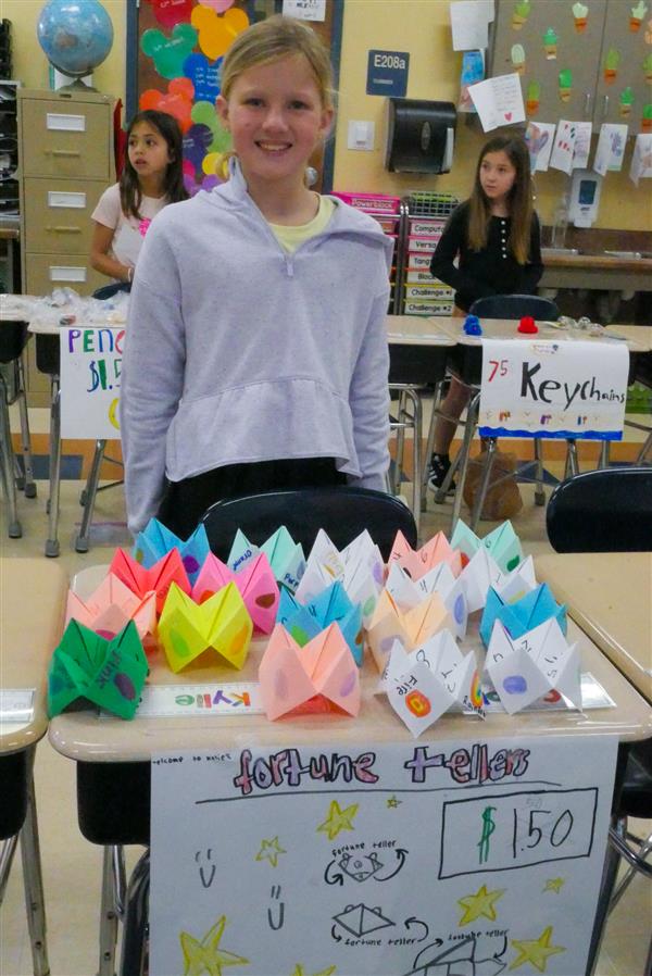 girl selling colorful fortune tellers